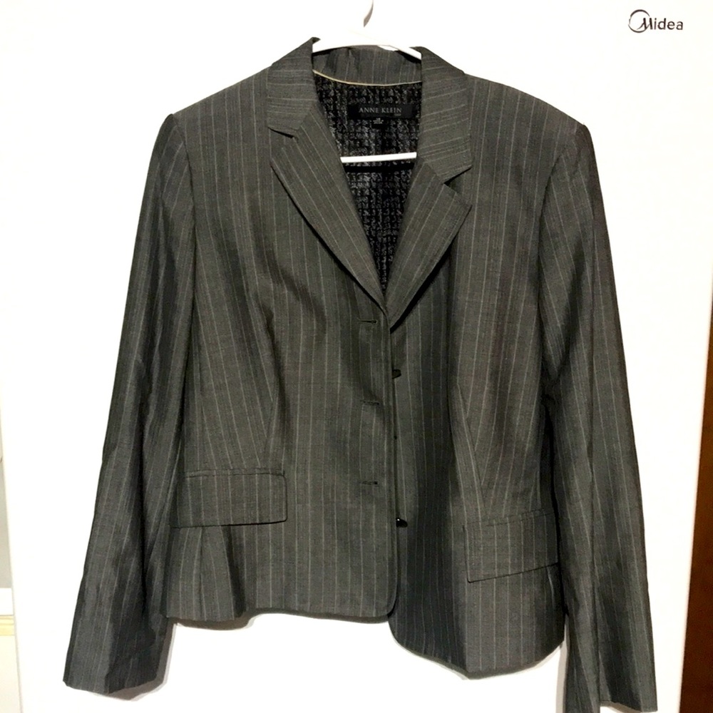 A gray  pin stripe skirt jacket suit